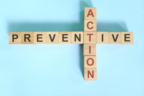 wooden blocks crossword puzzle laid out to say preventive action